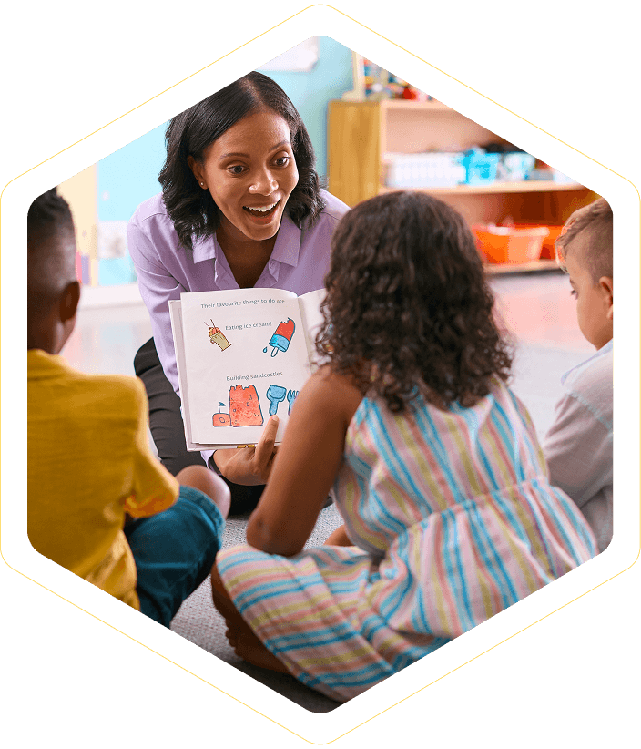 Teacher reading to children in classroom setting.